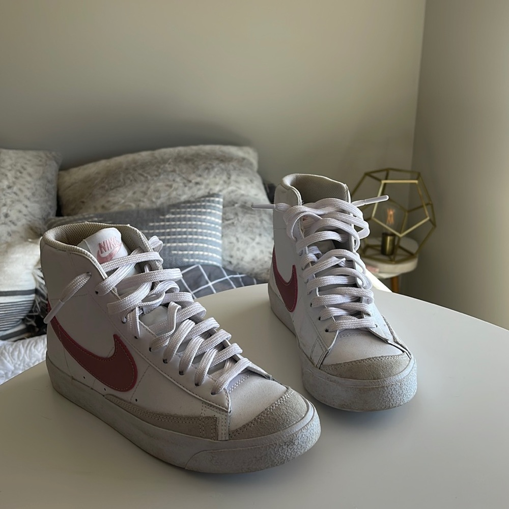 White and rose gold Nike blazers.